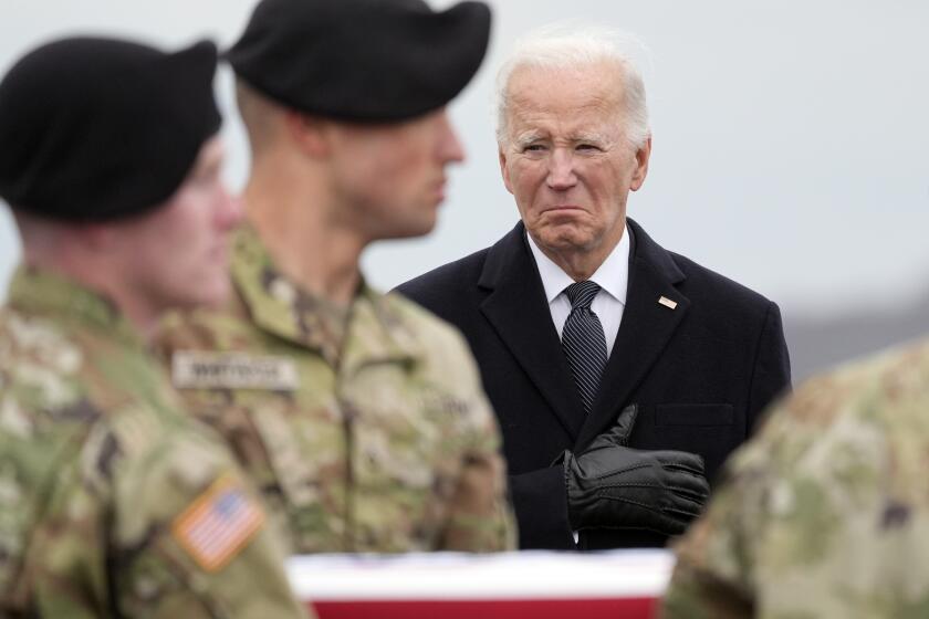 President Joe Biden watches as an Army carry team moves the flag-draped transfer case containing the remains of U.S. Army Sgt. Breonna Alexsondria Moffett, 23, of Savannah, Ga., during a casualty return at Dover Air Force Base, Del., Friday, Feb. 2, 2024. Moffett was killed in a drone attack in Jordan on Jan. 28. (AP Photo/Alex Brandon)