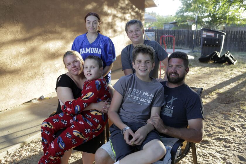 The Smith famliy at their Ramona home July 14, 07/14/20. Back from left, Ryann, 16, and brother Troy, 11. Front from left, mother Alicia, son Blake, 9, son Darek, 14 and father Darrell. photo by Bill Wechter