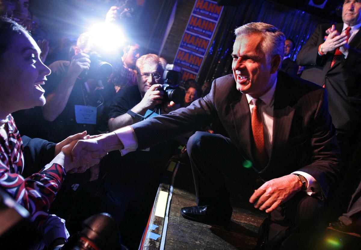 During his run as mayor, James Hahn shakes hands with supporters at a Conga Room party.