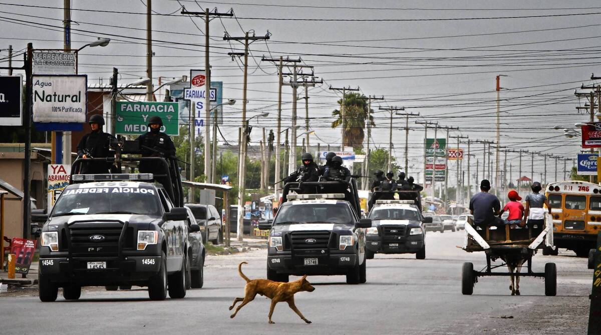 Truckloads of Mexican federal police ride through Matamoros. A corps of specially vetted federal units, as well as Mexican naval special forces, has proved most ready to put aside anti-U.S. sentiment to work closely with American trainers in combating the nation's drug cartels.