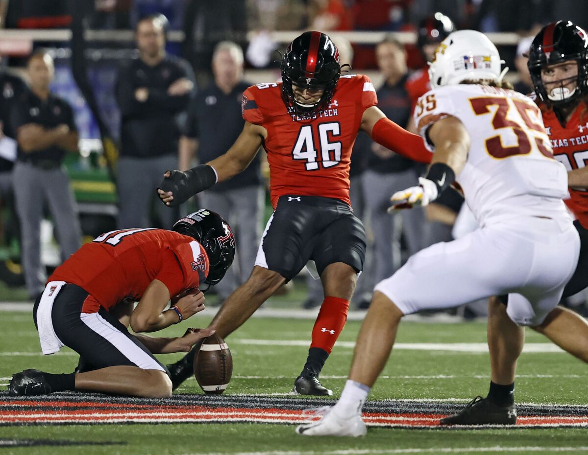 FILE - Texas Tech's Jonathan Garibay (46) kicks the winning 62-yard field goal during the second half of an NCAA college football game against Iowa State, Nov. 13, 2021, in Lubbock, Texas. Garibay is bypassing his final season of eligibility, instead opting to declare for the NFL draft after a season in which he set an NCAA record for the longest game-winning field goal. Garibay's 62-yard field goal on the final play against Iowa State on Nov. 13 as the longest kick in FBS to providing the winning points with less than a minute remaining. (AP Photo/Brad Tollefson, File)