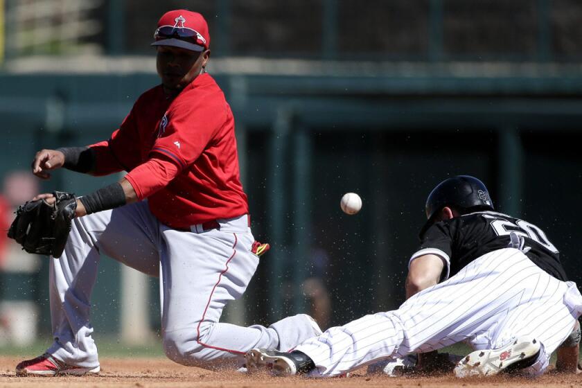 White Sox's J.B. Shuck is safe at second after Angels shortstop Erick Aybar misses the throw during the White Sox's 5-3 spring training win over the Angels on Sunday.