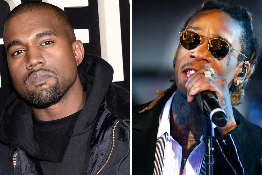 Rappers Kanye West and Wiz Khalifa have reportedly ended their feud.