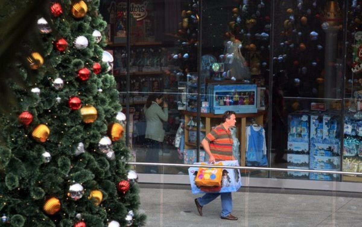 A shopper in Santa Monica loads up on Black Friday 2012. But Black Friday seems to be losing its luster.