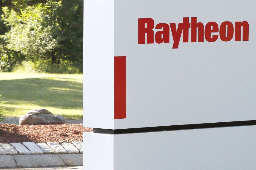 FILE - A sign stands at the road leading to the Raytheon facility in Marlborough, Mass., on June 10, 2019. China on Thursday, Feb. 16, 2023, imposed trade and investment sanctions on U.S. military contractors Lockheed Martin and Raytheon for supplying weapons to Taiwan, stepping up efforts to isolate the island democracy claimed by the ruling Communist Party as part of its territory. (AP Photo/Bill Sikes, File)