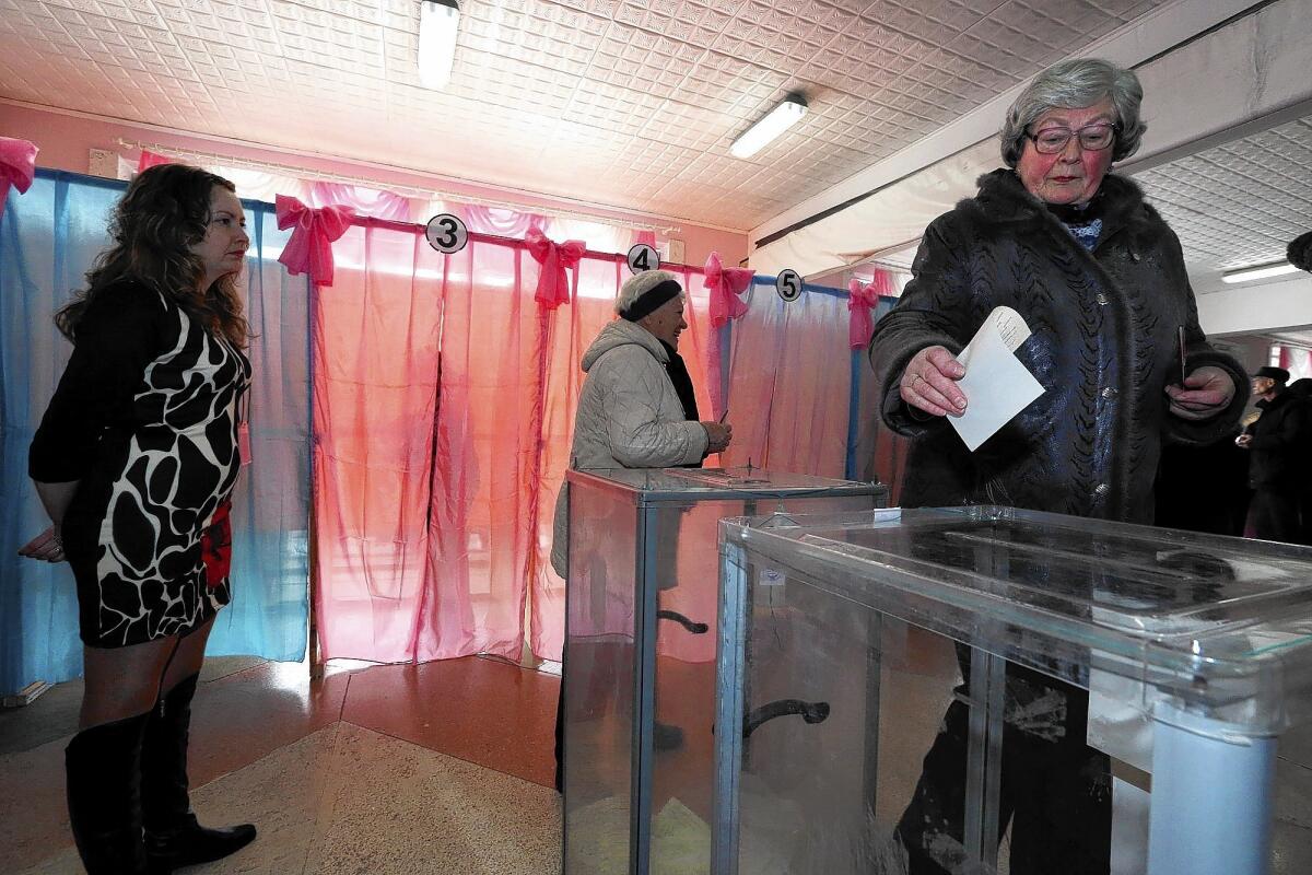 People in Perevalne, Crimea, vote on breaking away from Ukraine.