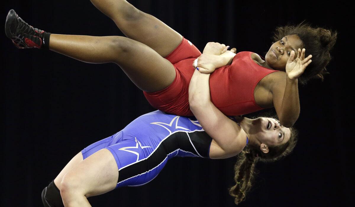 Adeline Gray, bottom, takes down Puerto Rico's Ana Gonzalez during the Pan Am Games on July 17, 2015.