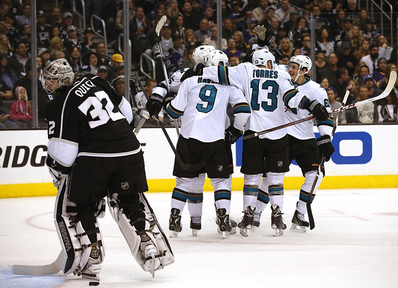Sharks celebrate in front of Jonathan Quick