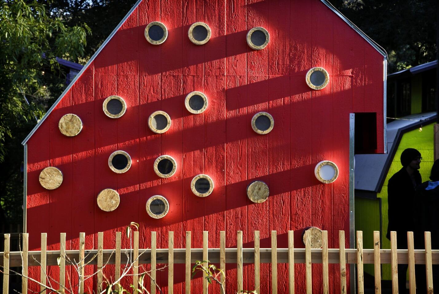 The miniature cabins were built at the Shadow Hills Riding Club, which will use them as part of an equestrian therapy program. The Woodbury students assigned to build a music-themed cabin painted their design red in homage to traditional barns, team member Angela Isayan said. For more on the function of the portholes, keep clicking …