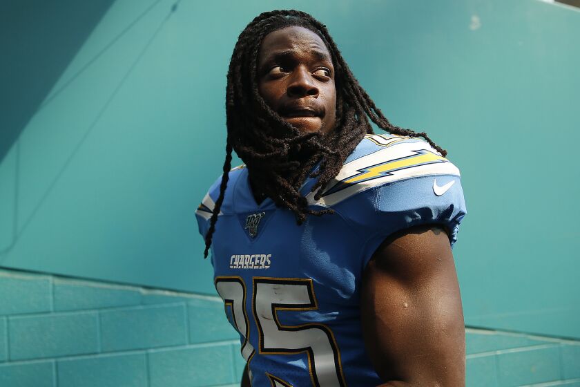MIAMI, FLORIDA - SEPTEMBER 29: Melvin Gordon #25 of the Los Angeles Chargers walks off the field after the game against the Miami Dolphins at Hard Rock Stadium on September 29, 2019 in Miami, Florida. (Photo by Michael Reaves/Getty Images)