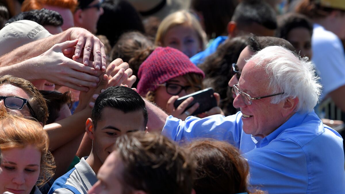 Democratic presidential candidate Sen. Bernie Sanders greets supporters after speaking at a rally in Santa Maria.