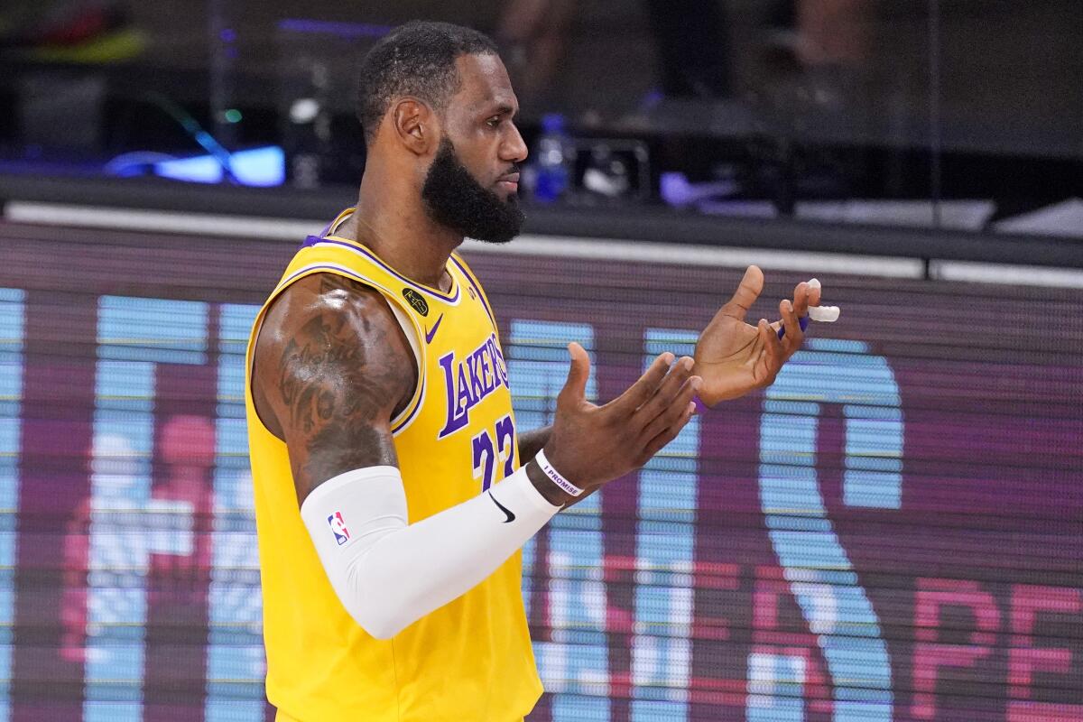 Lakers forward LeBron James reacts to a foul call during Game 4 against the Nuggets.