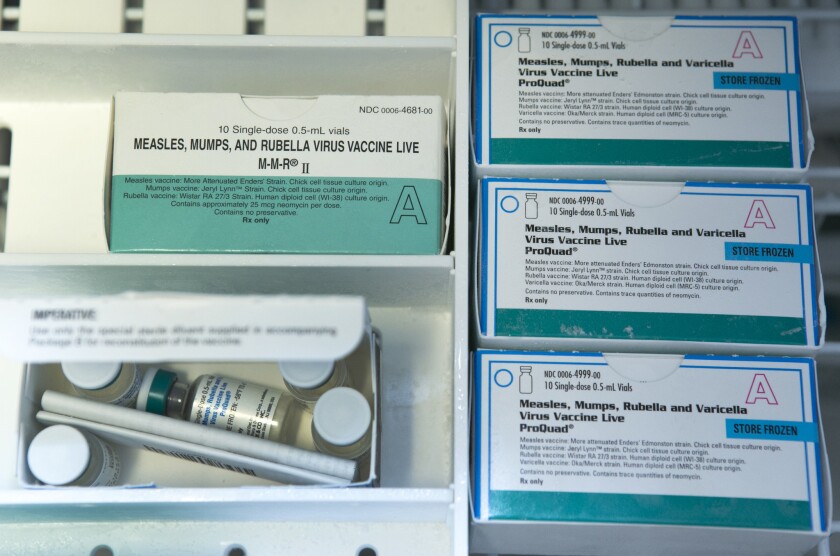 Boxes of single-doses vials of the measles-mumps-rubella virus vaccine live, or MMR vaccine and ProQuad vaccine are kept frozen inside a freezer at the practice of Dr. Charles Goodman in Northridge.