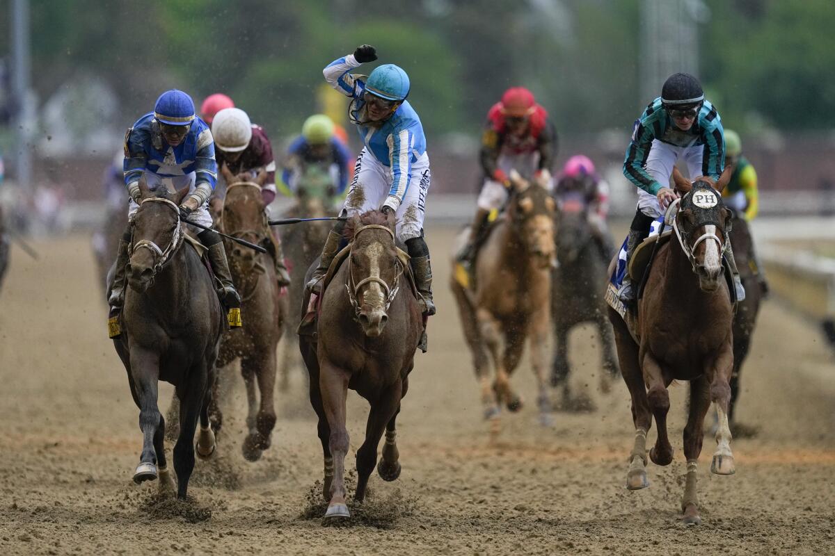 Javier Castellano celebrates after riding Mage to victory in the 149th running of the Kentucky Derby