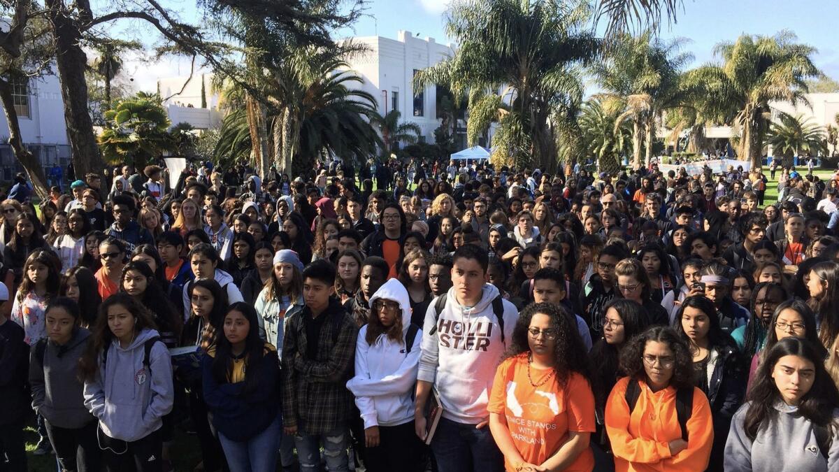 Venice High School students listen as the 17 victims of the Parkland, Fla., shooting are honored during Wednesday's walkout.