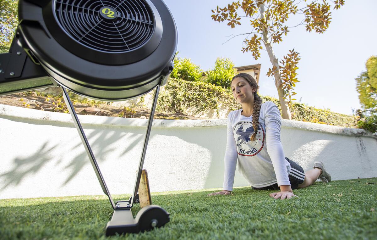 Yasmin Kallel, a freshman at Corona del Mar High, works out on a Zoom call at her home with her rowing team from the Newport Sea Base on Tuesday.