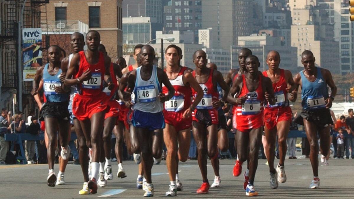 The elite male runners run up 23rd Street in Queens during the 2003 New York City Marathon.