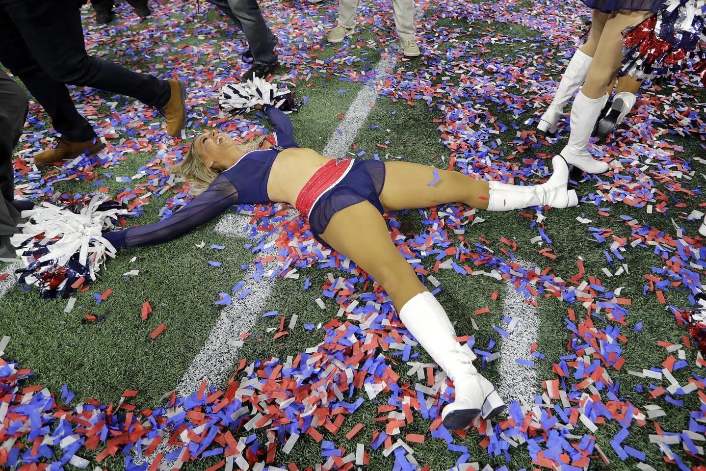 A New England Patriots cheerleader celebrates after the NFL Super Bowl 53 football game between the Los Angeles Rams and the Patriots Sunday, Feb. 3, 2019, in Atlanta. The Patriots won 13-3.