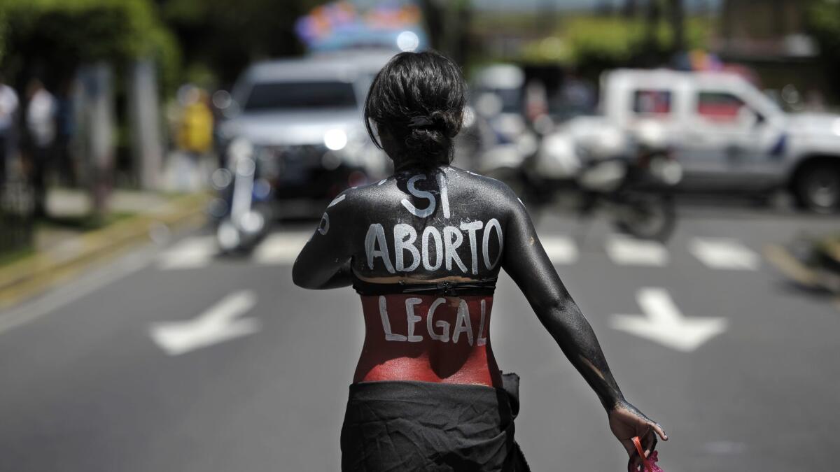 A woman marches in support of the decriminalization of abortion, on September 28, 2012 in San Salvador.