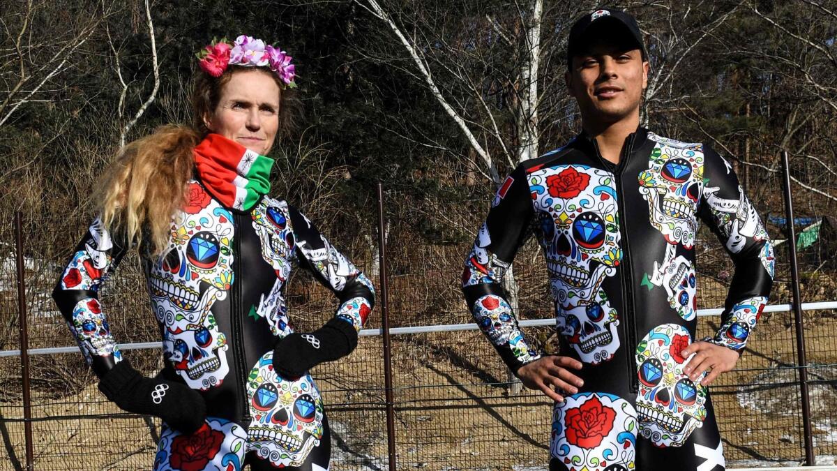 Team Mexico alpine skiers Sarah Schleper and Rodolfo Dickson pose in their team uniforms Feb. 12 in Pyeongchang.