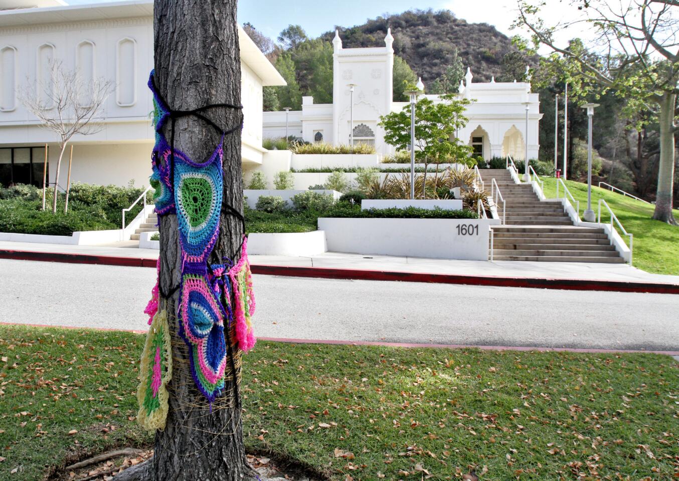 The Brand Library has recently been yarn bombed, as the knit graffiti movement calls it, as seen in Glendale on Thursday, December 24, 2015. Yarn decor appeared on some of the trees, light stands and pillars at the historic landmark.