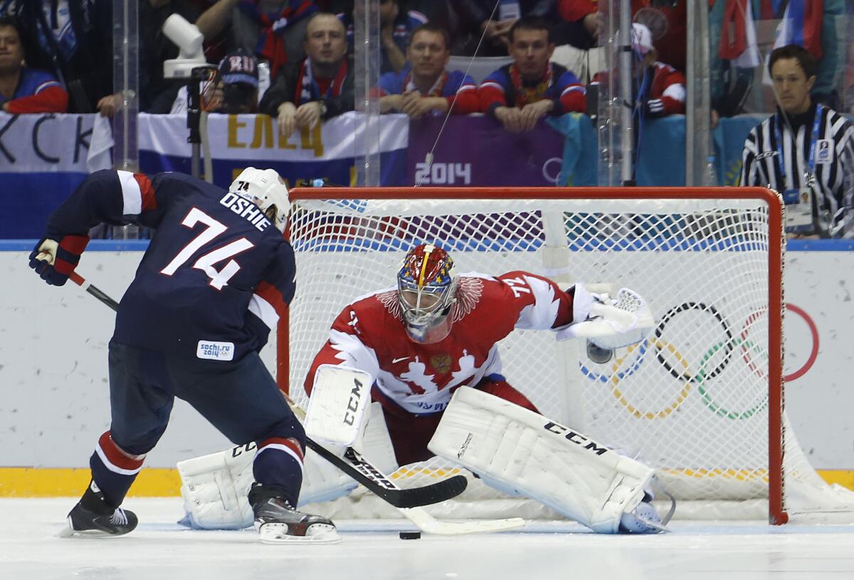 U.S. forward T.J. Oshie takes a shot against Russian goaltender Sergei Bobrovsky during a shootout in a men's ice hockey game at the 2014 Winter Olympics in Sochi, Russia. Oshie scored the clinching goal and the U.S. won, 3-2.