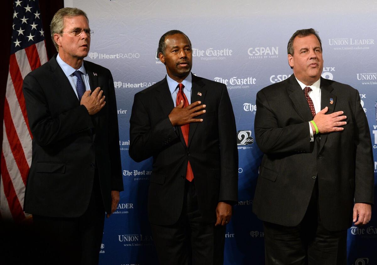 Former Florida Gov. Jeb Bush, Dr. Ben Carson and New Jersey Gov. Chris Christie, seen at a Republican presidential candidates' forum on Aug. 3, will be among the 10 candidates participating in the GOP debate on Aug. 6.