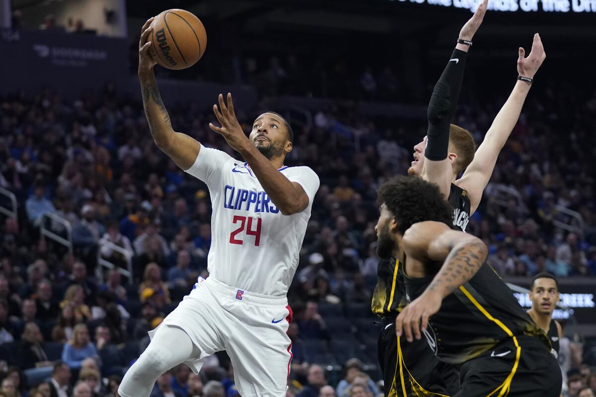 Clippers forward Norman Powell shoots against Golden State on Nov. 23