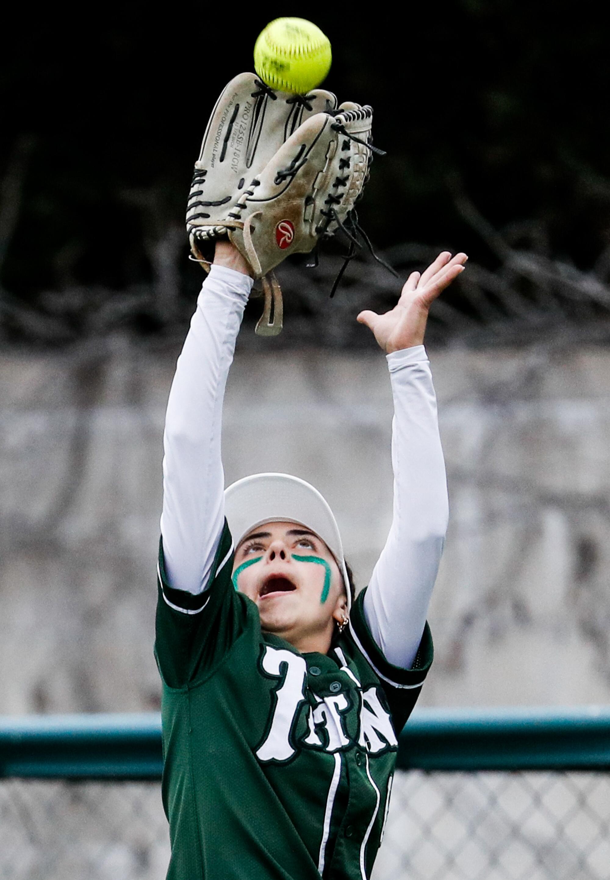 Poway's Autumn Busman catches the ball in the outfield 