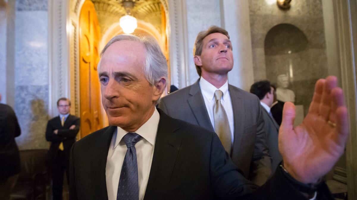Sens. Bob Corker, front, and Jeff Flake — seen here in 2013 — have both rebuked President Trump.
