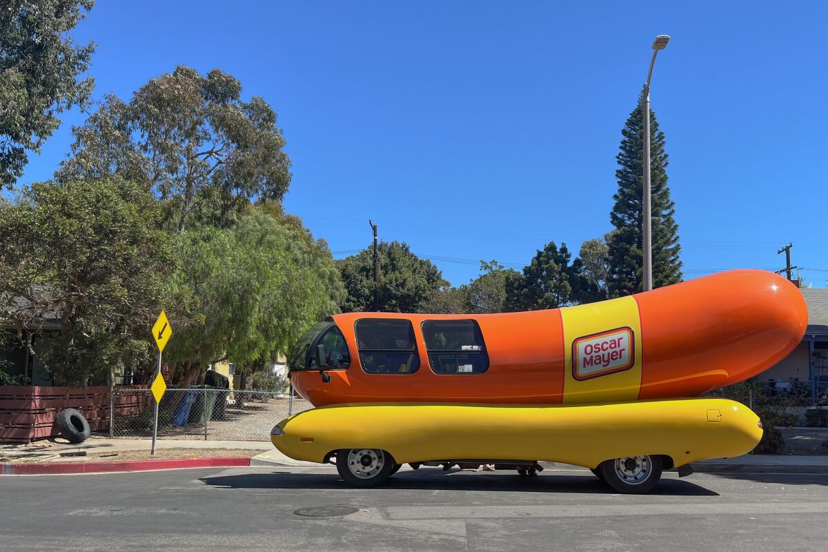 Hotdoggers Abbey Rank and Keila Garza ride around in the Oscar Mayer Wienermobile as it visits L.A.