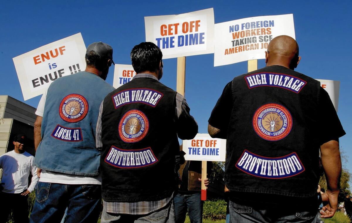 More than 300 members of the International Brotherhood of Electrical Workers rally Tuesday at the Southern California Edison offices in Irvine in support of their fellow Edison employees and protested what they say are unfair labor practices at the Southland’s largest utility.