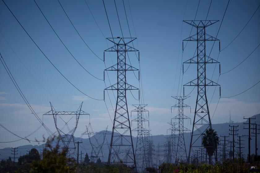Power lines during a heatwave in North Hollywood, California, US, on Thursday, Sept. 1, 2022. After narrowing avoiding blackouts, California faces another bruising test of its power grid Thursday as a heat wave smothering the region builds, driving temperatures to dangerous levels. Photographer: Eric Thayer/Bloomberg via Getty Images