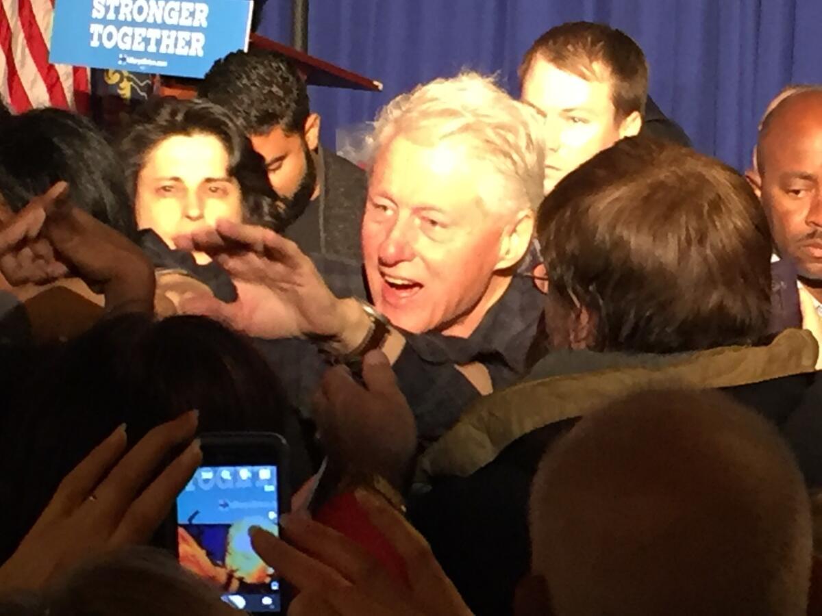 Former President Bill Clinton works the rope line in the steel town of Aliquippa, Pa.