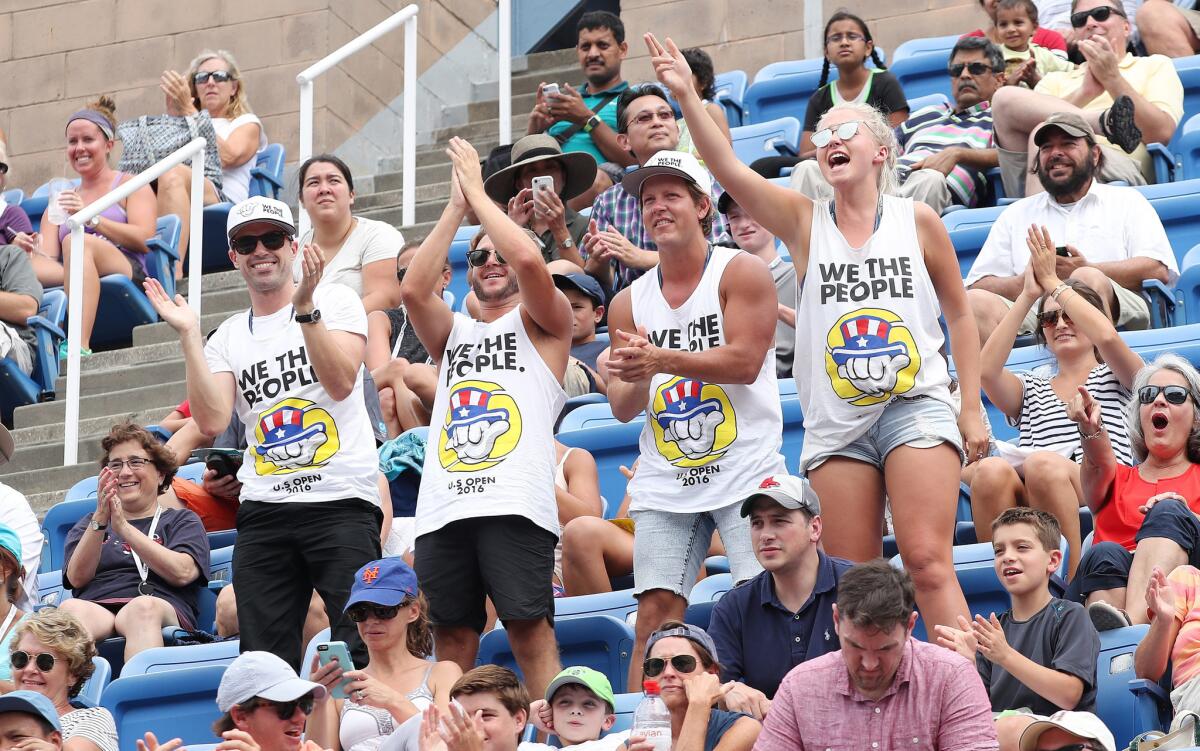 Fans cheer as Steve Darcis plays John Isner on the third day of the U.S. Open tennis championships at the USTA National Tennis Center on Aug. 31.