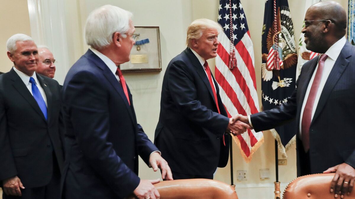 President Trump greets Bernard J. Tyson, right, CEO of Kaiser Permanente, and Joseph R. Swedish, CEO of Anthem, during a Feb. 27 meeting with health insurance executives. Also attending were Vice President Mike Pence and Health and Human Services Secretary Tom Price.