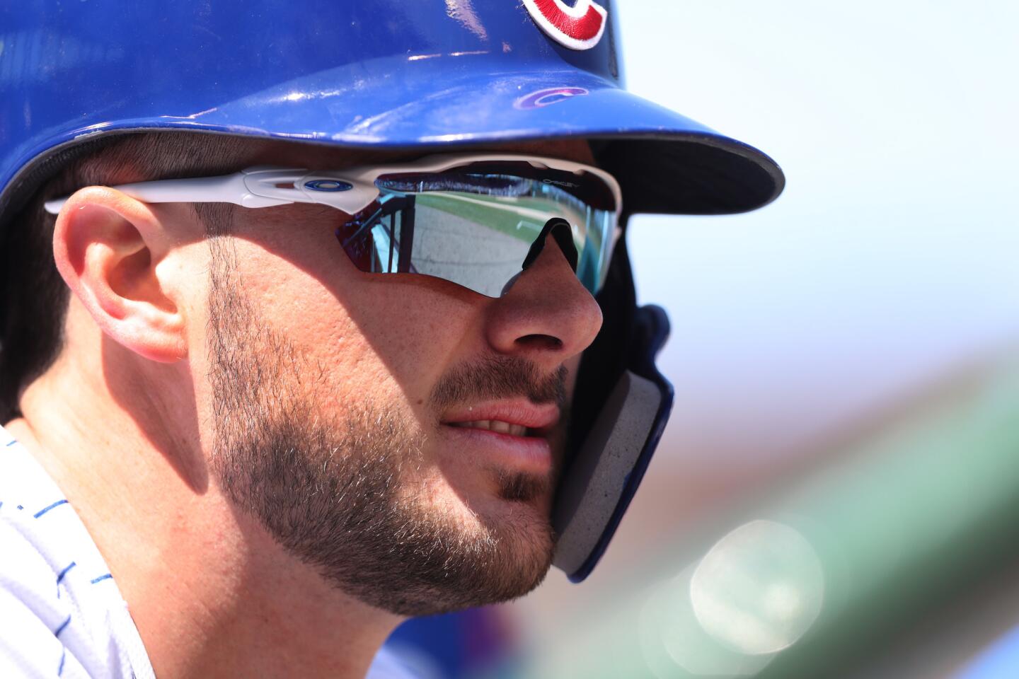 Kris Bryant looks out of the dugout before his at-bat in the third inning against the Milwaukee Brewers at Wrigley Field in Chicago on Saturday, April 28, 2018.