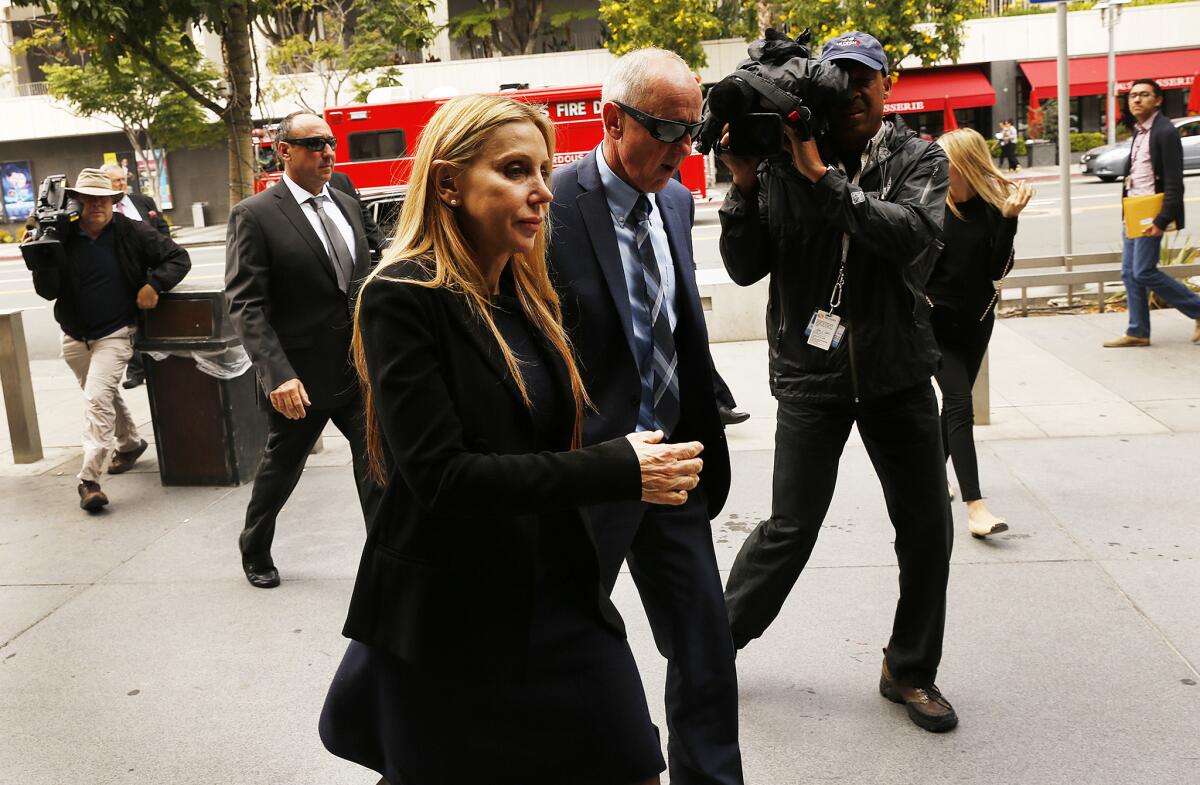 Manuela Herzer, former girlfriend and companion of Sumner Redstone, is escorted to a courthouse in May.