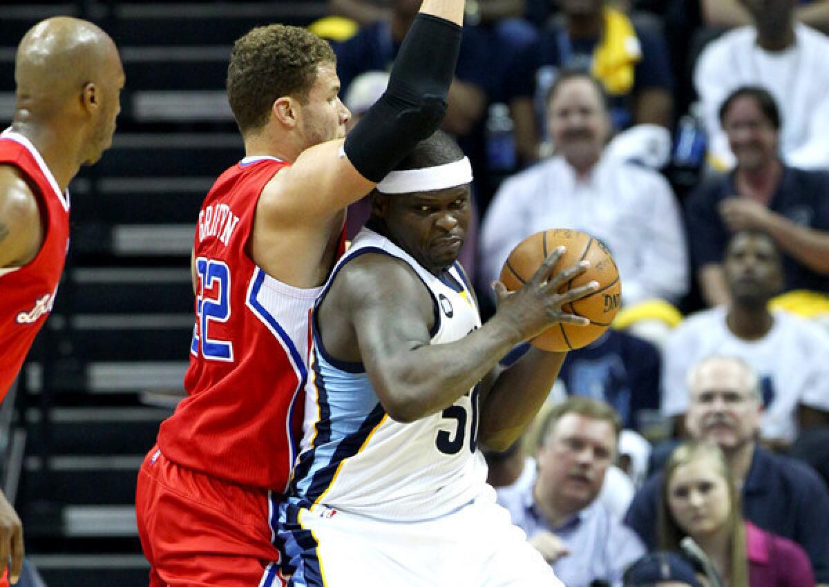 Clippers forward Blake Griffin tries to hold his ground on defense against Grizzlies power forward Zach Randolph in the first half of Game 3 on Thursday night.