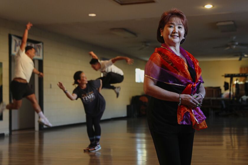 SAN DIEGO, CA-December 7: Joji Ramirez Castro dance director and choreographer for PASACAT Philippine Performing Arts stands at her studio in National City on Wednesday, December 7, 2022. (Sandy Huffaker for The San Diego Union Tribune)