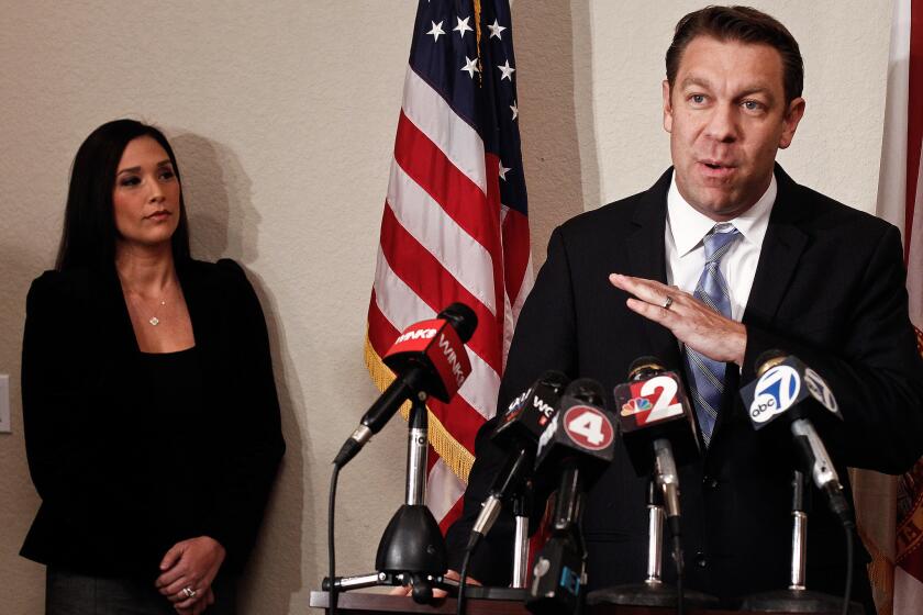 Rep. Trey Radel (R-Fla.) addresses the media alongside his wife, Amy, last month. Radel returned to the House this week to cast his first vote since pleading guilty to drug charges.