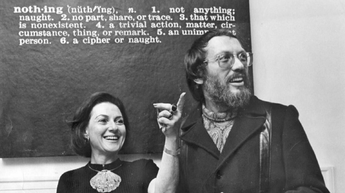 Elyse and Stanley Grinstein greet guests for a 1972 party at their home under Joseph Kosuth's "Nothing."