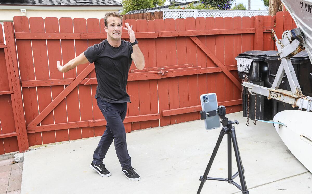Kevin McClintock, a teacher at The Rock Academy, practices a dance challenge before posting it to his Tik Tok feed called "Mr. McTikTok" on April 28, 2020 in San Diego, California. McClintock has amassed more that 80K followers and on video got 1.3 million views.