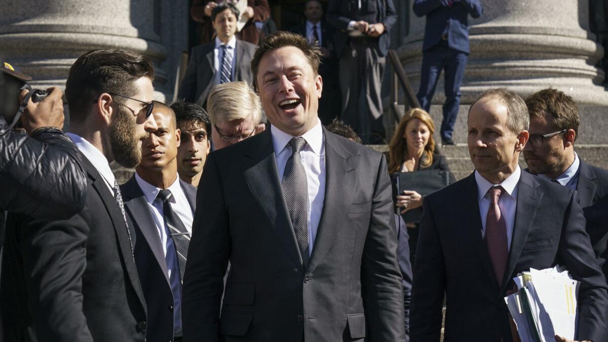 Tesla CEO Elon Musk exits federal court in New York on April 4.