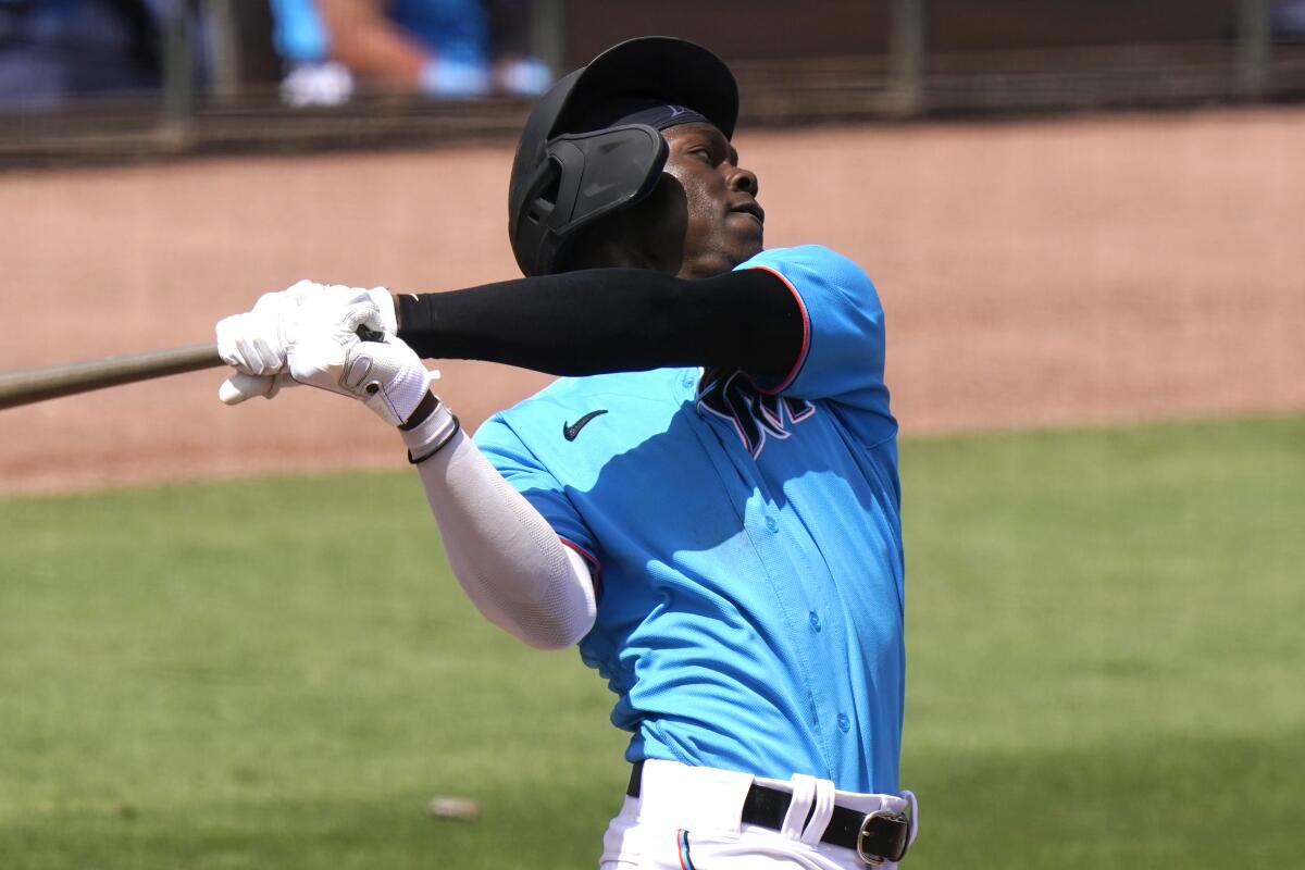 Miami Marlins' Jazz Chisholm hits a solo home run during the fifth inning of a spring training baseball game against the New York Mets, Wednesday, March 17, 2021, in Jupiter, Fla. (AP Photo/Lynne Sladky)