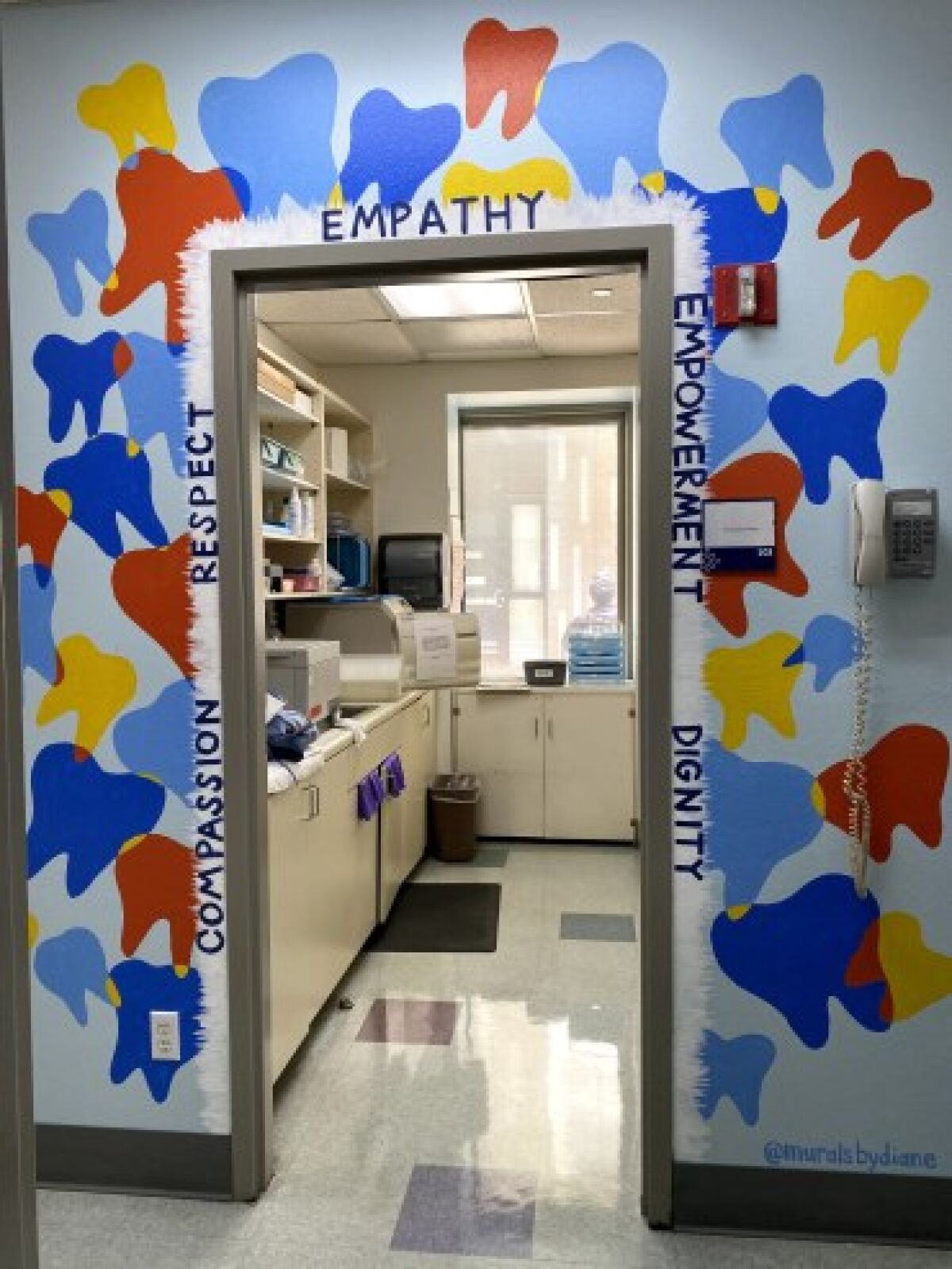 For Father Joe's Villages' dentist's office, Diane Lehman painted teeth in various bright colors around the doorway.