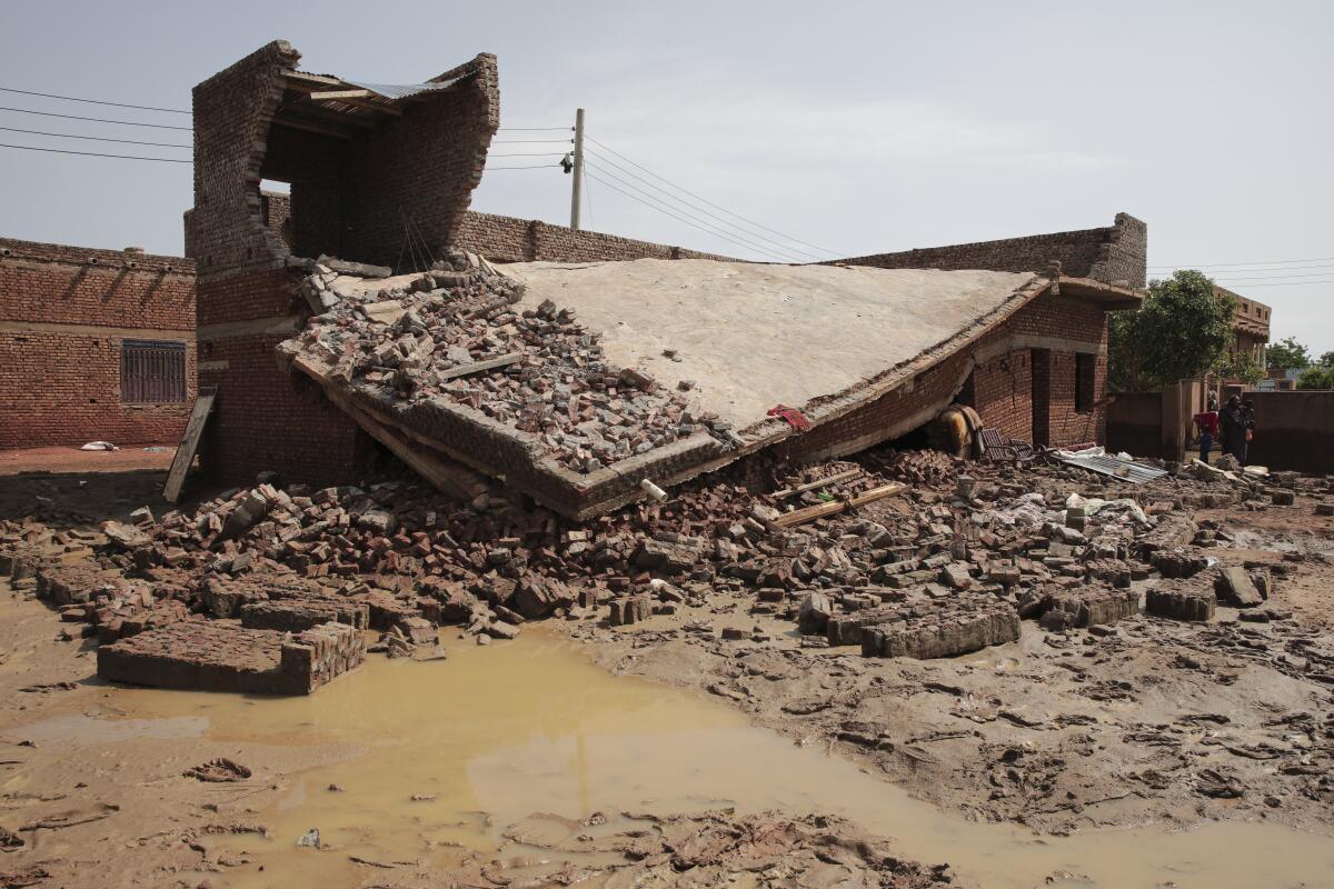 FILE - Damage is seen after a heavy rainfall in the village of Aboud in the El-Manaqil district of the Al-Jazirah Province of Sudan, August 22 2022. Flash flooding across Sudan has killed at least 20 people over the past week, raising the official death toll since the rainy season began in May to 134. The country's National Council for Civil Defense said an additional 120 people had been injured in the flooding in the past week. AP Photo/Marwan Ali, File)