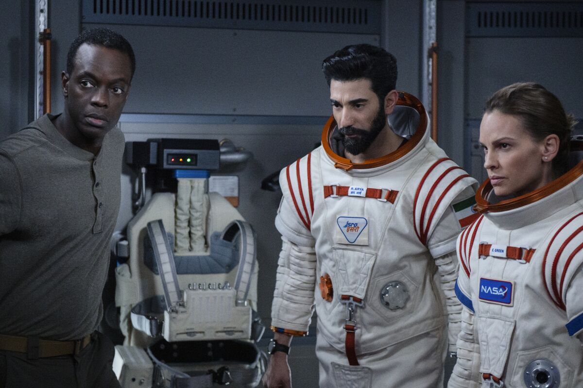Ato Essandoh, Ray Panthaki and Hilary Swank star in "Away," debuting Friday on Netflix.