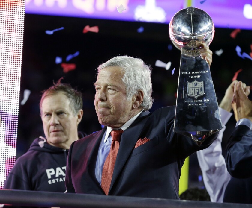 Patriots owner Robert Kraft accepts the Vince Lombardi Trophy as NFL champions following the 28-24 win over the Seahawks.