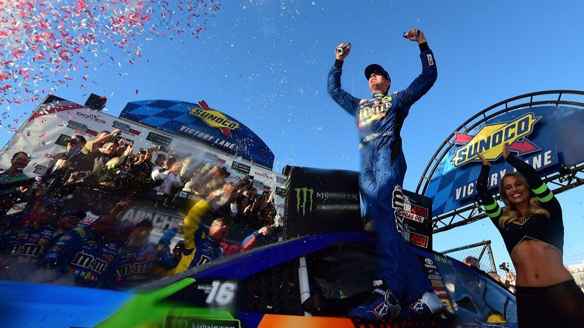 Kyle Busch celebrates in Victory Lane after winning the Monster Energy NASCAR Cup Series Apache Warrior 400 presented by Lucas Oil at Dover International Speedway on Sunday.